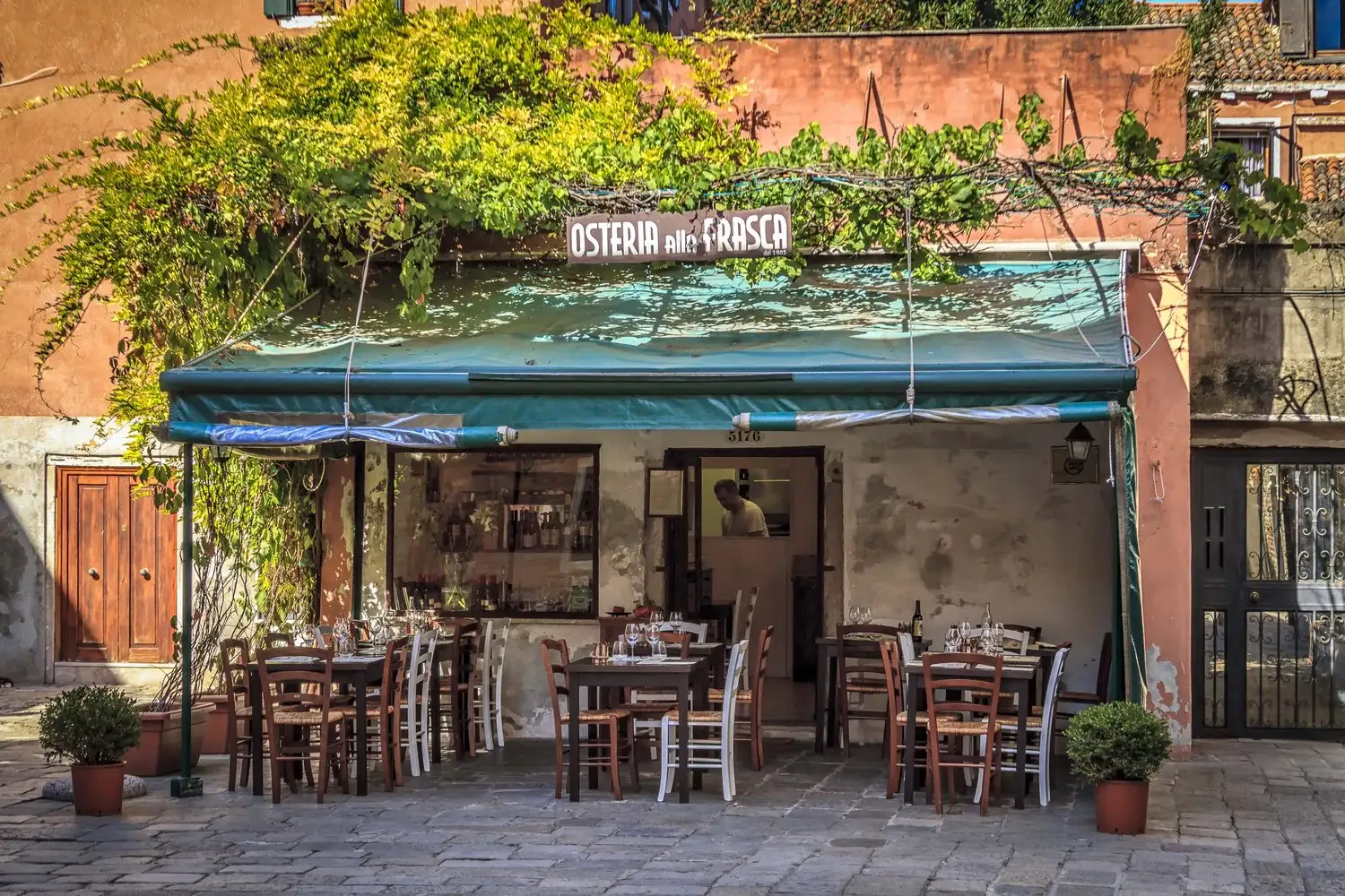Tuscan restaurant patio with tables